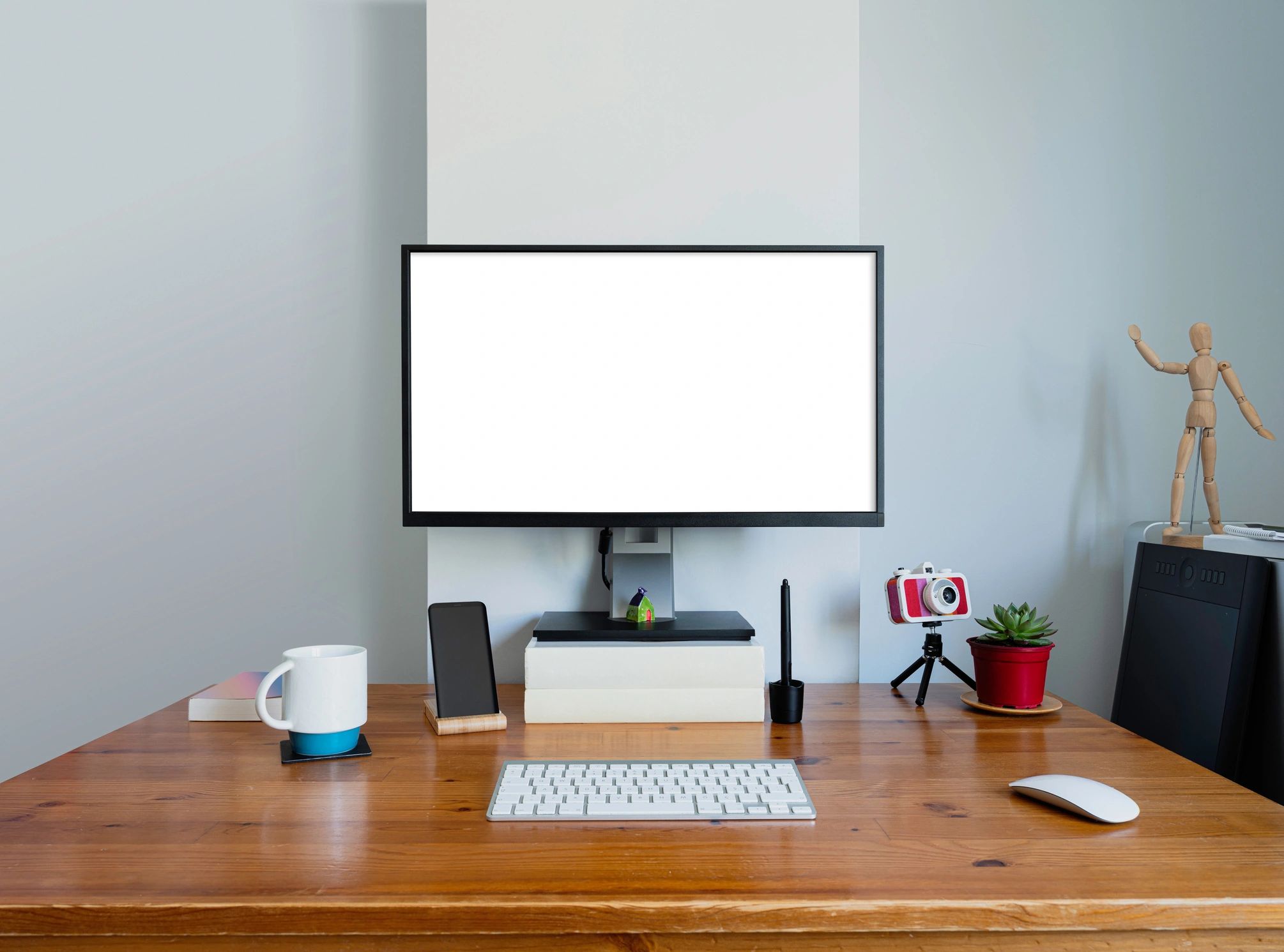 Home office desk with monitor and workspace accessories