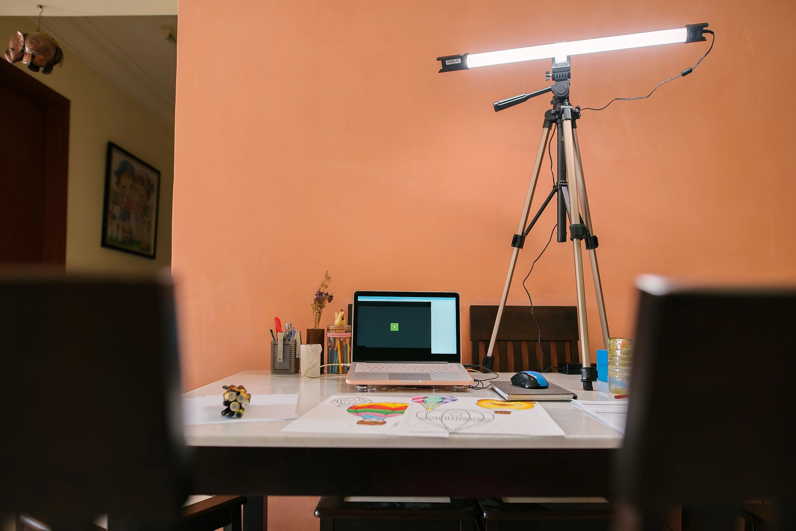 Laptop workspace prepared for video calls with webcam-ready setup