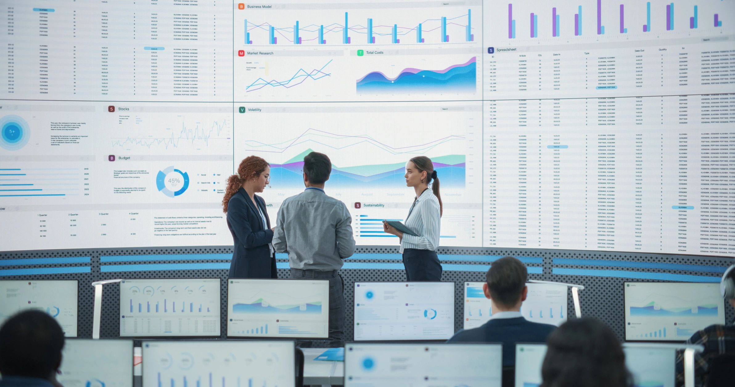 Technology specialists reviewing digital systems in an office