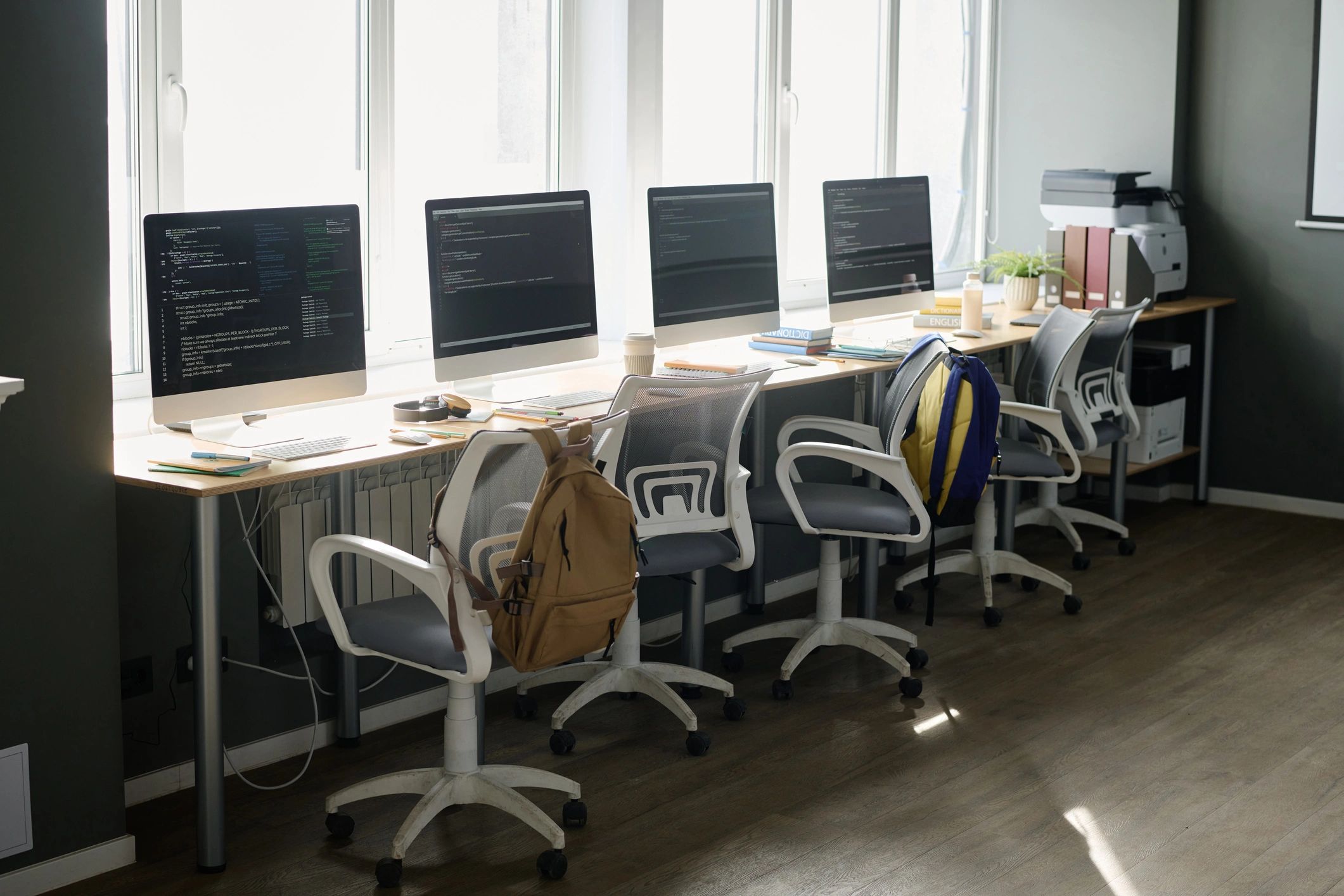 Modern computer classroom with streamlined desktop setups