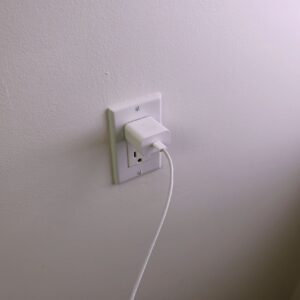 USB-C Cable Connected to Wall Charger in Outlet