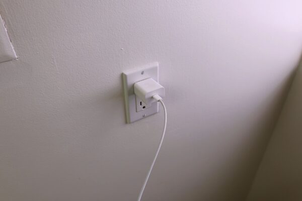 USB-C Cable Connected to Wall Charger in Outlet