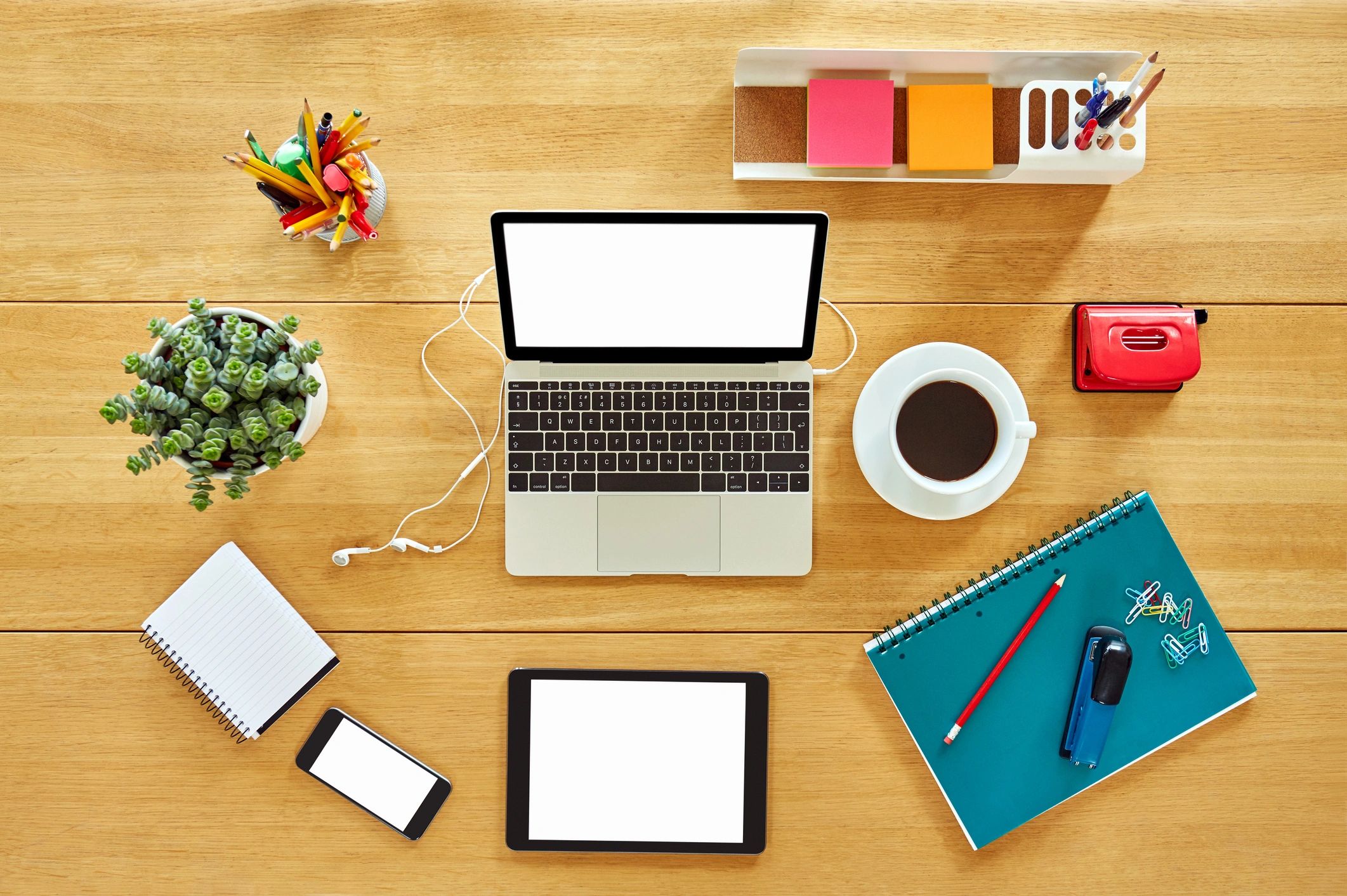 Consumer electronics and workspace accessories on a desk